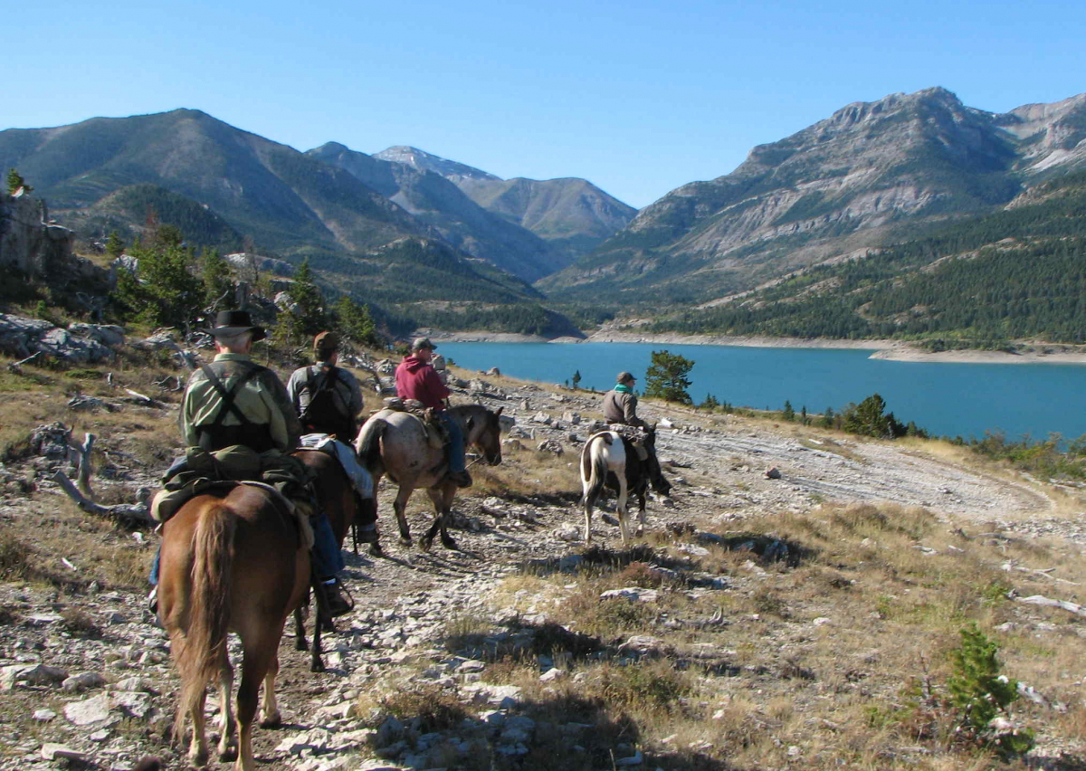 Horseback riding into hunting camp